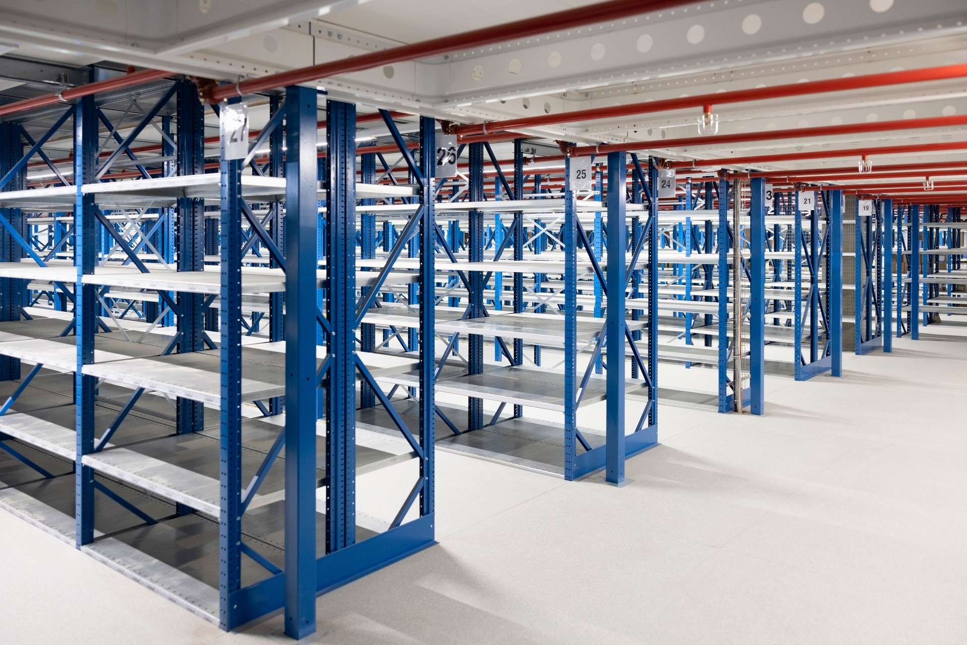 Large empty racks in modern distribution warehouse